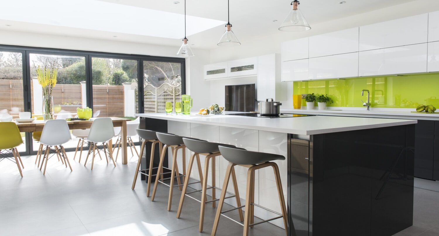 Aluminium bifold doors opened onto a kitchen extension patio