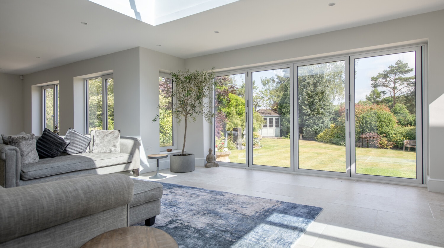 Bright open living room with double glazed aluminium windows